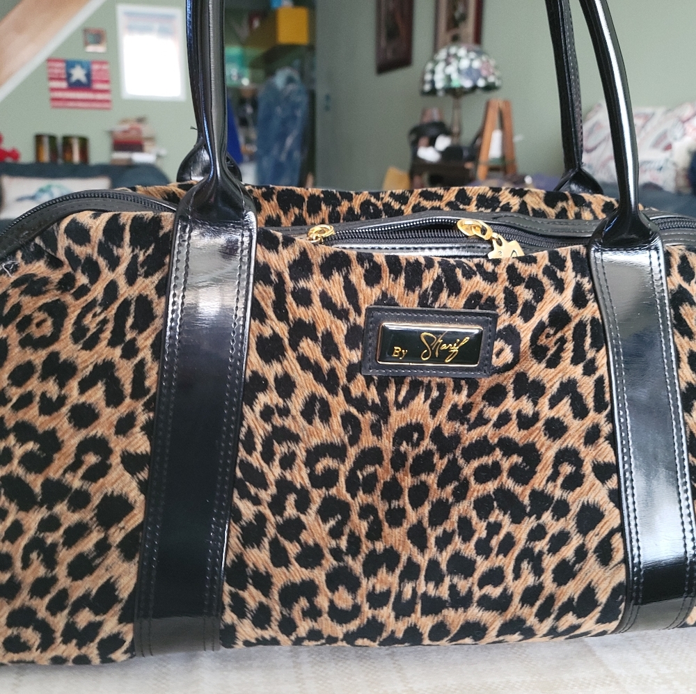 Sharif plush leopard print oversized Dr's bag.  Patent leather trim.